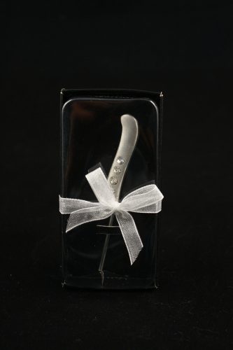 ON CAKE SERVER/CROSS. "1